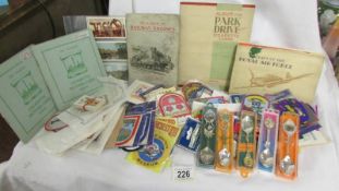 A good selection of tourist souvenir cloth patch badge and a quantity of cigarette card albums.