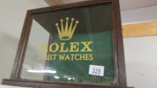 A glazed cabinet with Rolex signage. Collect only.