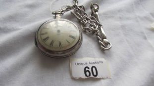 A silver pocket watch with outer protective case on a 53 gram silver watch chain.