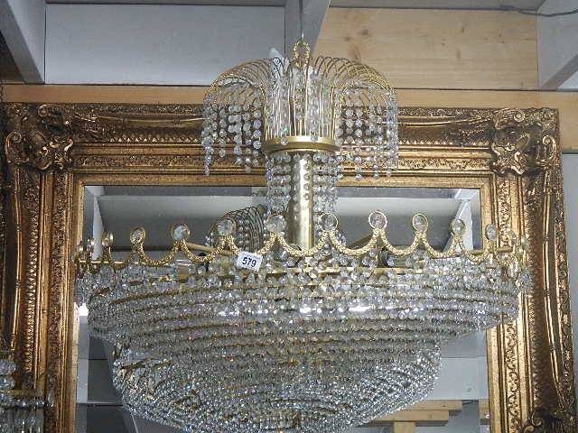 A large layered glass chandelier, approximately 86 cm diameter and 76 cm drop. Collect only.