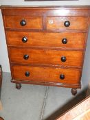 A two over three mahogany chest of drawers. Collect only.