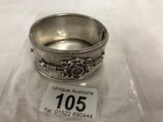 A decorative silver bangle, 37.9 grams. 32mm wide. 43mm x 47mm inside. Outer circumference