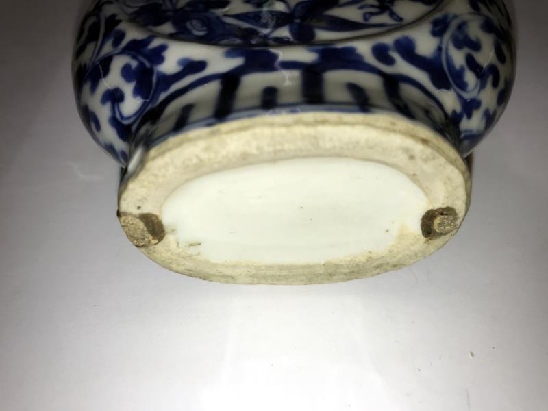 A pair of early Chinese blue and white lidded vases (both lids a/f) and a blue and white flask. - Image 10 of 25