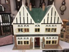 A large dolls house and contents. Size not including base, 86cm x 45cm x 82cm