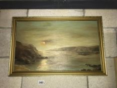 A gilt framed oil on board Coastal sunset lanscape signed M.Edgar