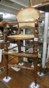 A Victorian child's high chair with bergere seat.