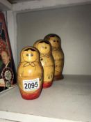 A vintage nest of 3 wooden Russian dolls, 2 have splits on top half