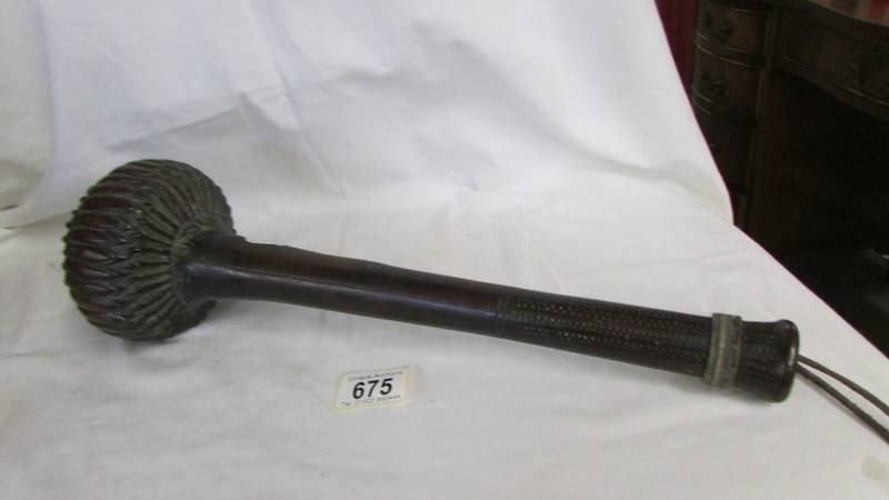 An early 19th century Fijian war club made of iron and wood. overall lenght 42 cm, club end 12 cm
