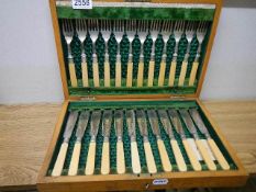 A cased set of 12 fish knives and forks.