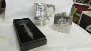 A Pontin's trophy tankard, a hip flask and a magnifying glass.