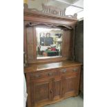 An arts and crafts mirror backed sideboard. (Collect only).