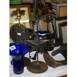 A mixed lot of metal ware including cast iron trivet, blue glass etc., (Collect only).