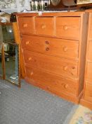 A three over three pine chest of drawers (Collect only).