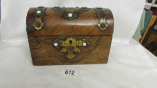 A walnut dome topped box with brass fittings (hinges a/f)