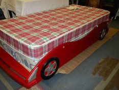 A child's single bed in the form of a racing car. (Collect only).