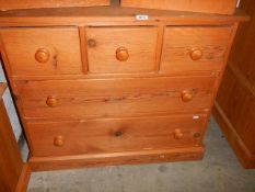 A three over two pine chest of drawers. (Collect only).