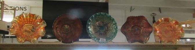 Five carnival glass dishes.