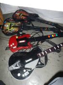 Four electric guitars for Playstation or X box. For spares or repair.