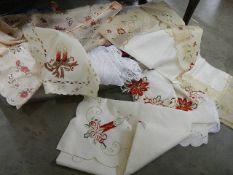 A mixed lot of table linen including embroidered.
