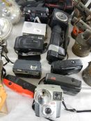 A mixed lot of assorted camera's.
