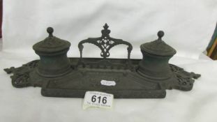 An old Bronze inkstand complete with liners but missing feet.
