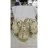 A Crown Devon Ewer and two floral decorated ewers. (Collect only).