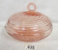An unusual swirl pattern pink glass lidded bowl.