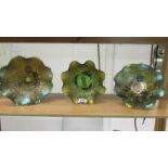 Three carnival glass bowls.