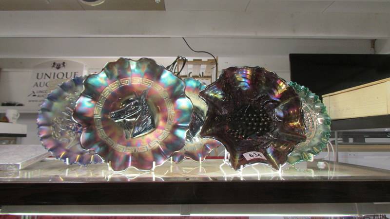 Five carnival glass dishes.