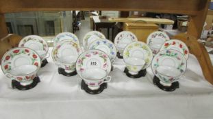 A set of 12 'Bloemen Van Netherland' floral decorated tea cups and saucers with stands.