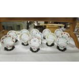 A set of 12 'Bloemen Van Netherland' floral decorated tea cups and saucers with stands.