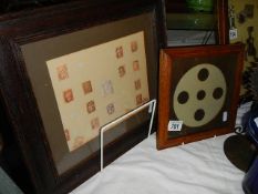 A framed collection of penny red stamps and a framed collection of penny coins.