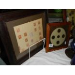 A framed collection of penny red stamps and a framed collection of penny coins.