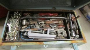 A tool box and assorted tools.