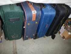 Four suitcases. (Collect only).