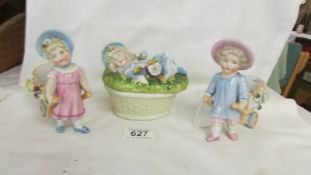 A pair of 19th century child figures and a lidded dish surmounted reclining child.