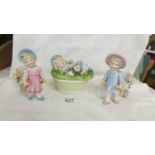 A pair of 19th century child figures and a lidded dish surmounted reclining child.