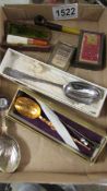 A mixed lot including commemorative spoons, small pipe, cheroot holder etc.,