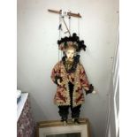 An ornate string puppet