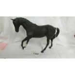 A Royal Doulton black horse.
