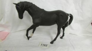 A Royal Doulton black horse.