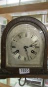 An 8 day mahogany mantel with silvered dial.