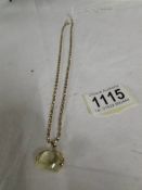 A crystal fob with attached gold chain (tests as 9ct), chain 9 grams.