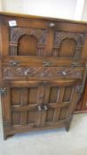 An oak drinks cabinet.