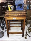 An Indian inlaid nest of 4 teak tables