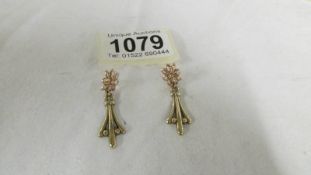 A pair of 9ct gold pendant earrings.