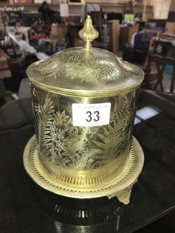 An ornate Edwardian silver plated biscuit barrel