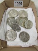 A mixed lot of USA coins including a 1922 silver dollar, 2 1944 silver half dollars,