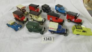 Twelve die cast model cars.