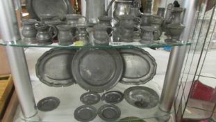 A good lot of old pewter measures, plates etc., (most measures marked).